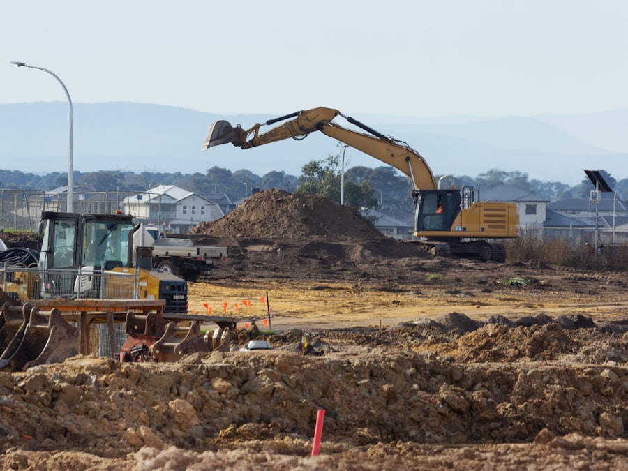 Construction equipment working across a commercial site under preparation.